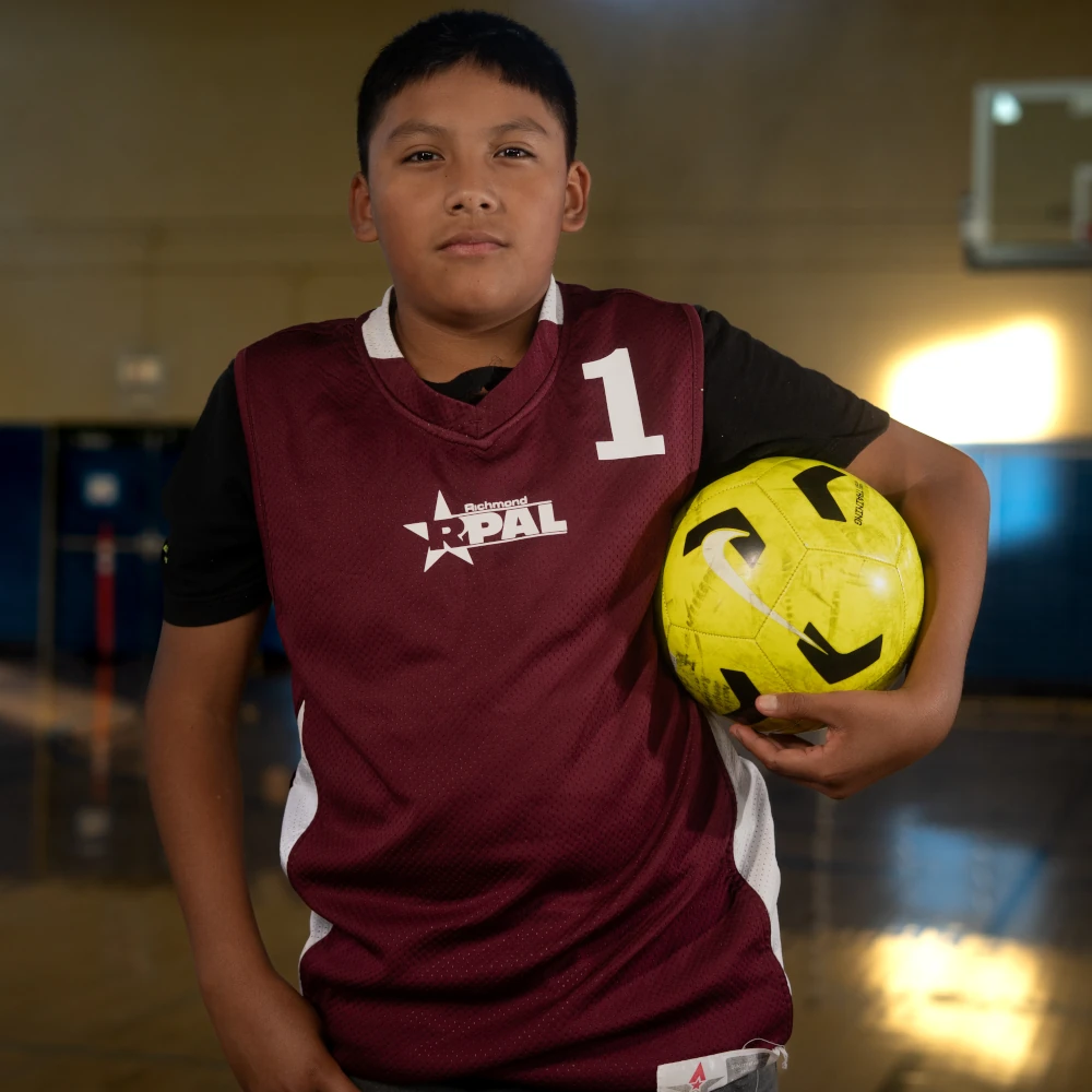 Boy holding a soccer ball