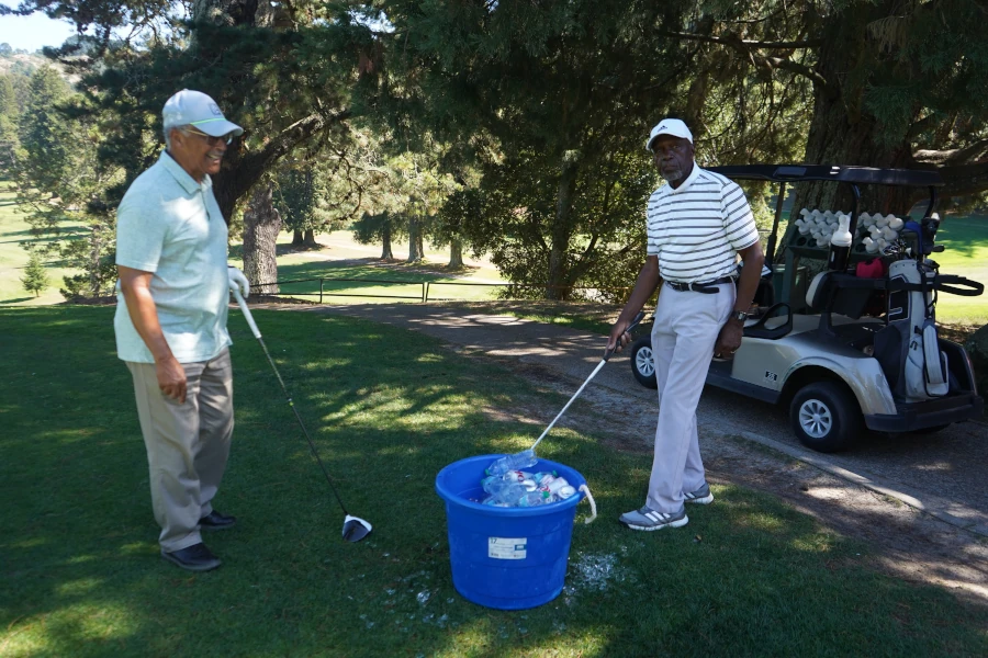 a pair of golfers by the path