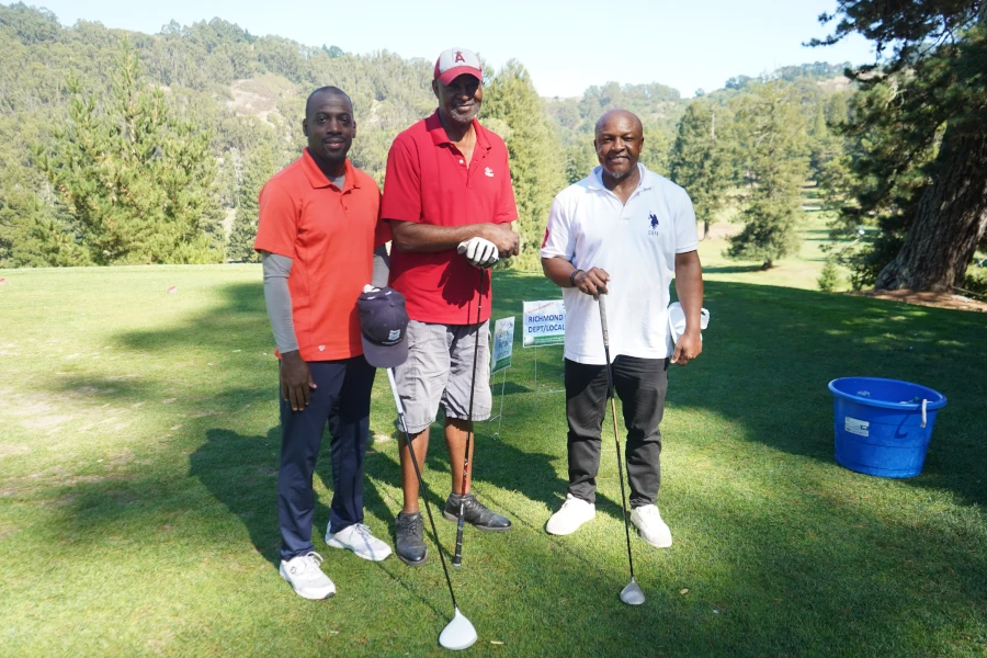 Three men on the golf course