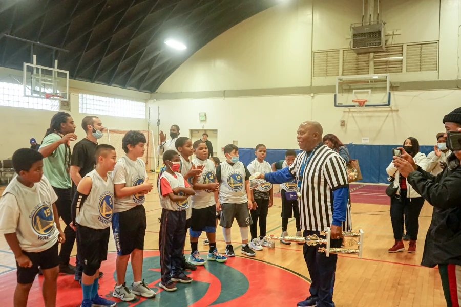 Coach speaking to the basketball team