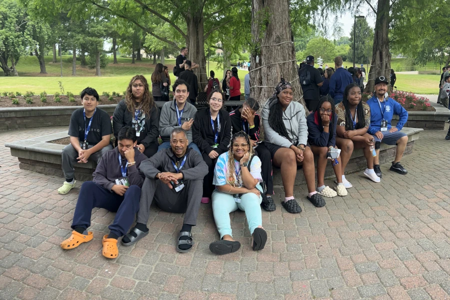 Group of kids sitting outside in a park