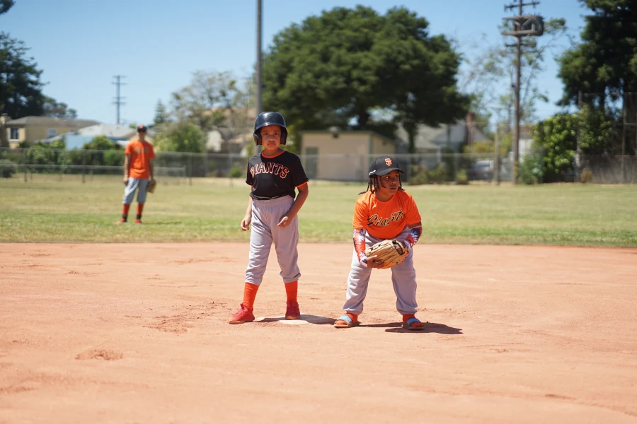 Kids playing baseball outdoors