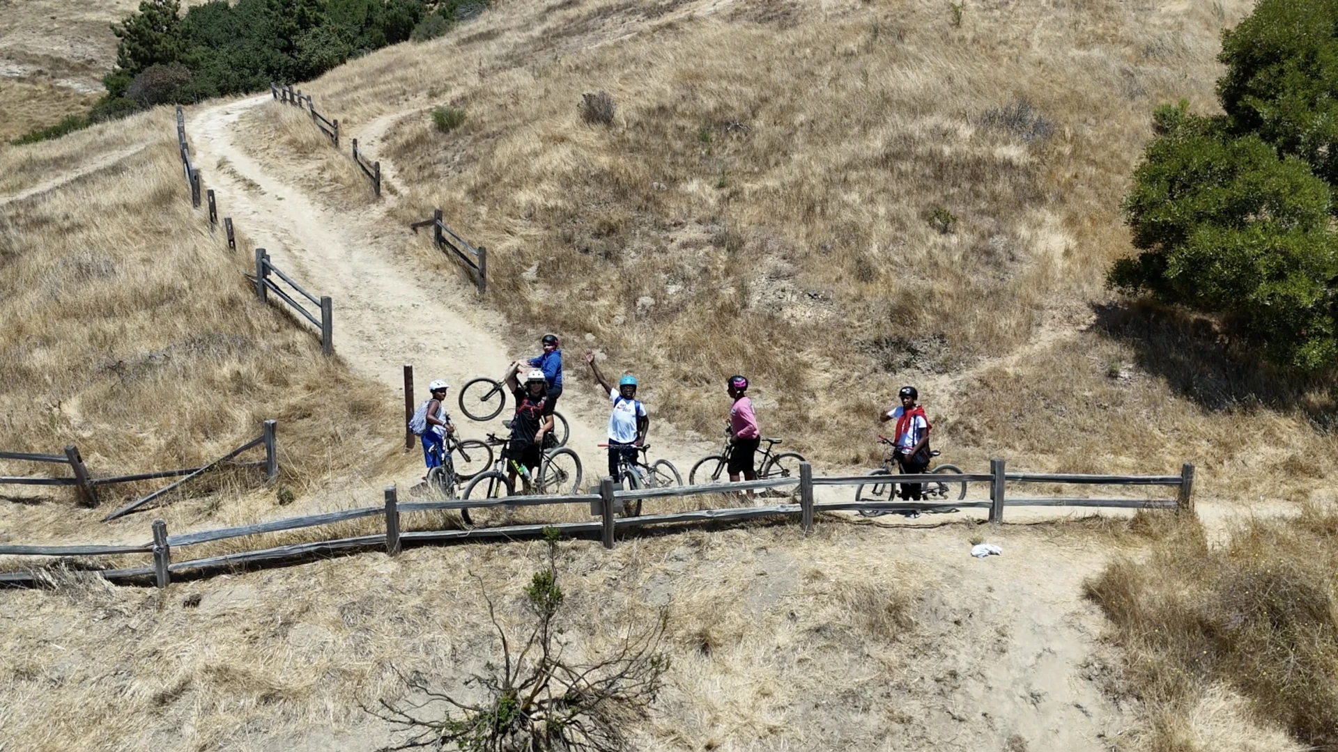 Children hiking along a hill path