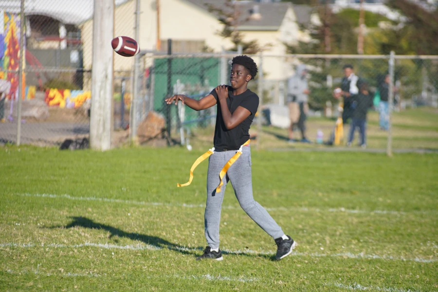 young man throwing a football