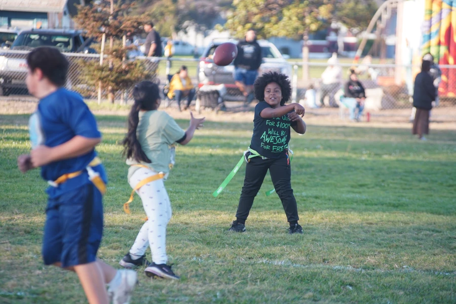 kids throwing a football