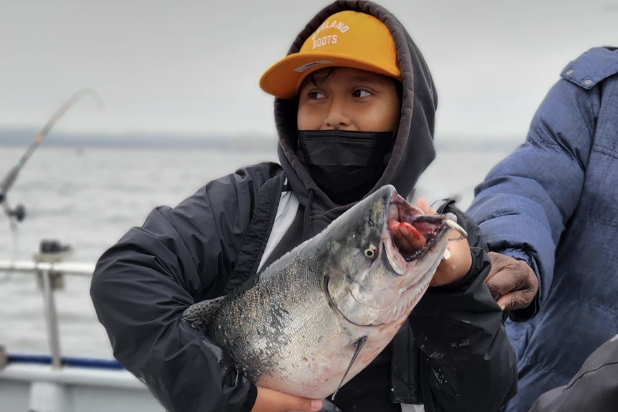 Boy holding a big fish